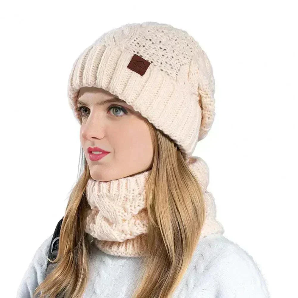 Woman wearing Glorious™ Winter Glow Duo cream knit hat and matching tube scarf winter set