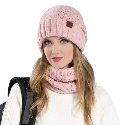 Glorious™ Winter Glow Duo pink knit hat and scarf set worn by woman for warmth and style